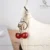 کیف قایقی دخترانه تیارا طرح کوچ COACH دارای آویز آلبالو - Image 9